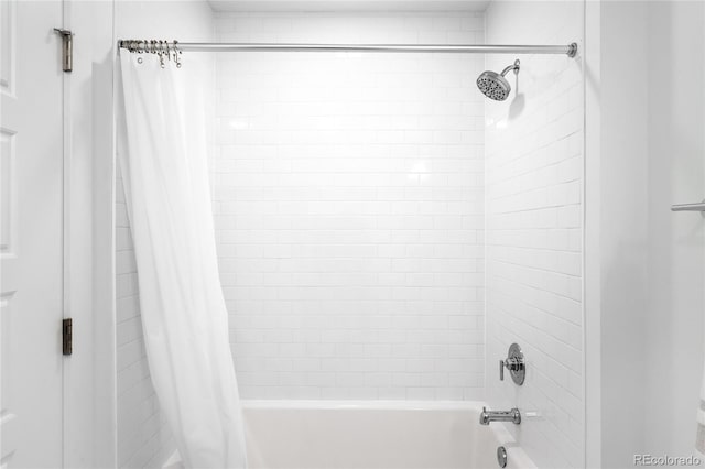 bathroom featuring shower / tub combo with curtain