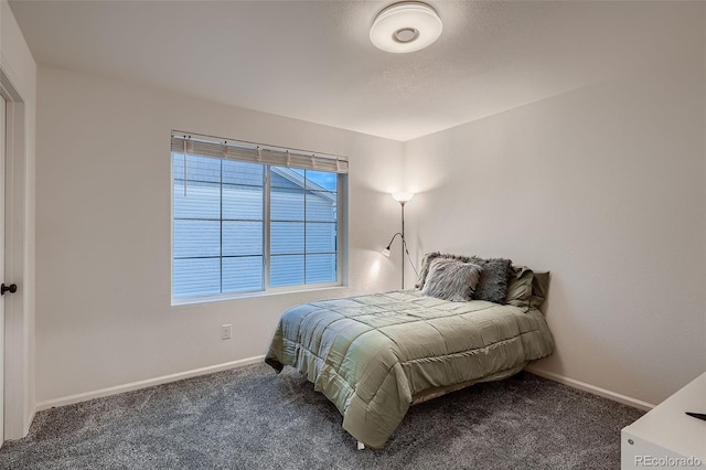 carpeted bedroom with baseboards