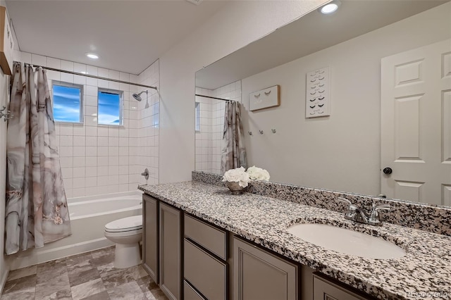 bathroom with recessed lighting, shower / bathtub combination with curtain, toilet, and vanity