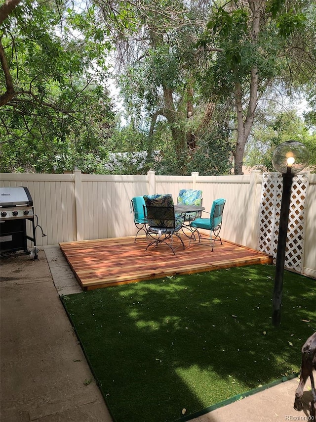 view of yard with a wooden deck