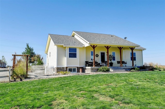 view of front of house featuring covered porch and a front lawn