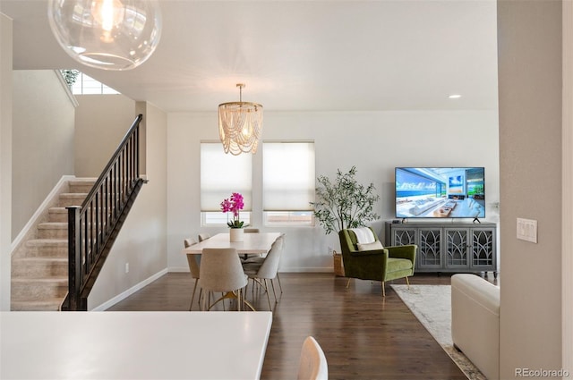 dining room featuring dark hardwood / wood-style floors and a chandelier