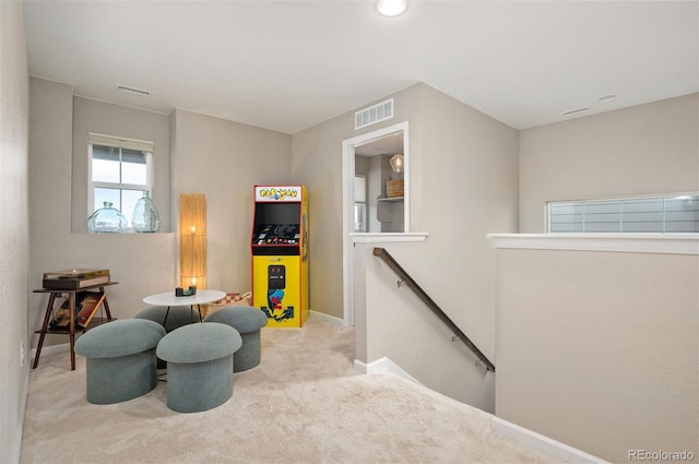 living area with light colored carpet