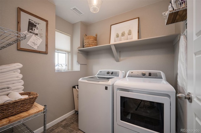 washroom with washer and dryer