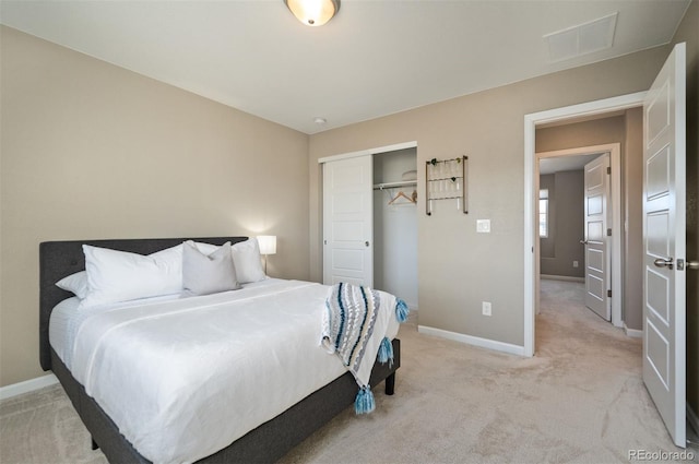 carpeted bedroom with a closet