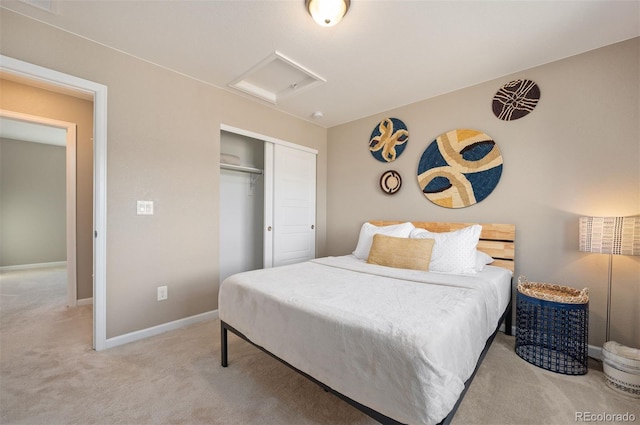 bedroom with light carpet and a closet