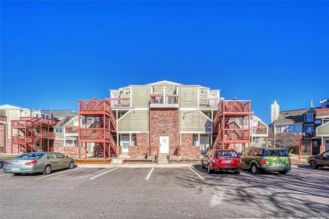 970 S Dawson Way Unit 10, Aurora, CO 80012 - view of building exterior with uncovered parking and stairway