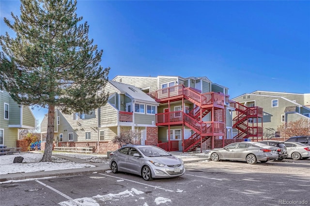 970 S Dawson Way Unit 10, Aurora, CO 80012 - view of building exterior featuring uncovered parking and stairway
