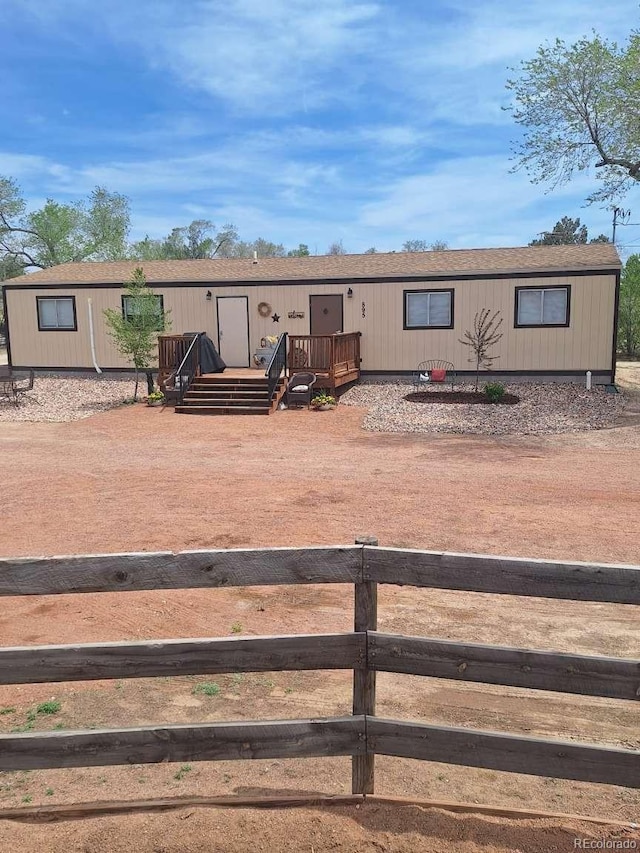 895 B St, Penrose, CO 81240 - manufactured / mobile home featuring a wooden deck and fence