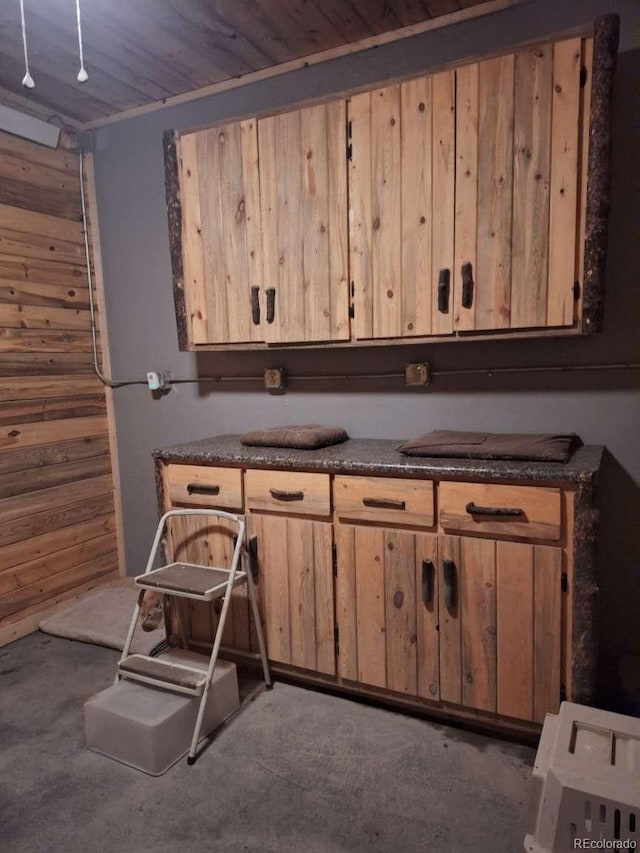 895 B St, Penrose, CO 81240 - kitchen with dark countertops, wood ceiling, and wooden walls