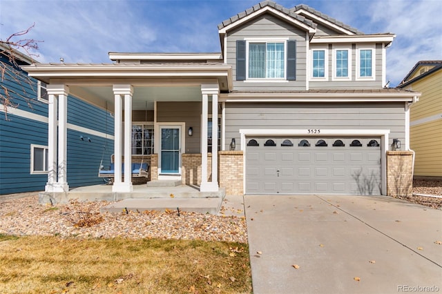 craftsman house featuring a garage, a porch, concrete driveway, and brick siding