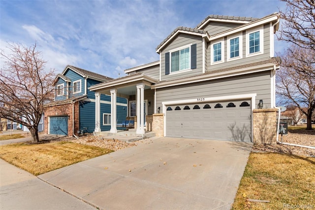 view of front of property featuring concrete driveway, brick siding, and an attached garage