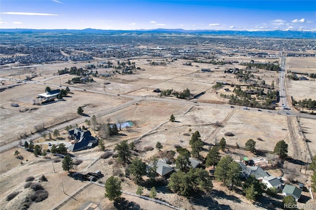 birds eye view of property featuring a mountain view