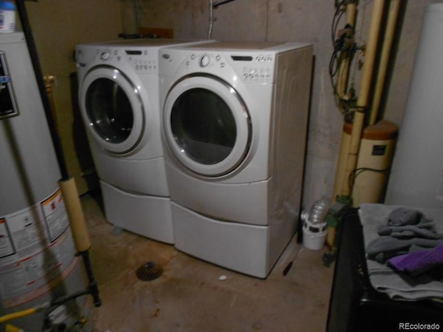 washroom featuring separate washer and dryer and water heater