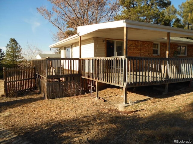 view of side of home featuring a wooden deck