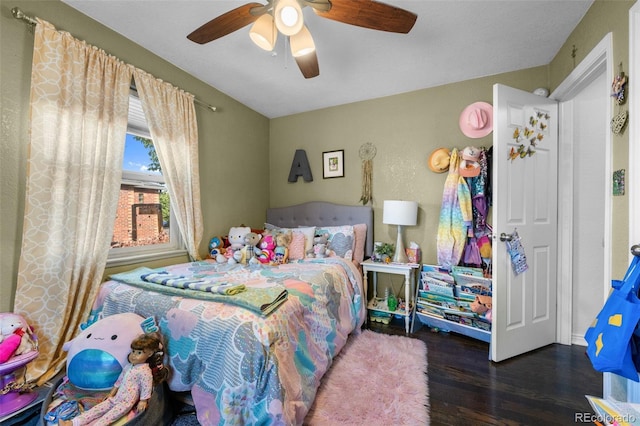 bedroom featuring ceiling fan and dark hardwood / wood-style flooring