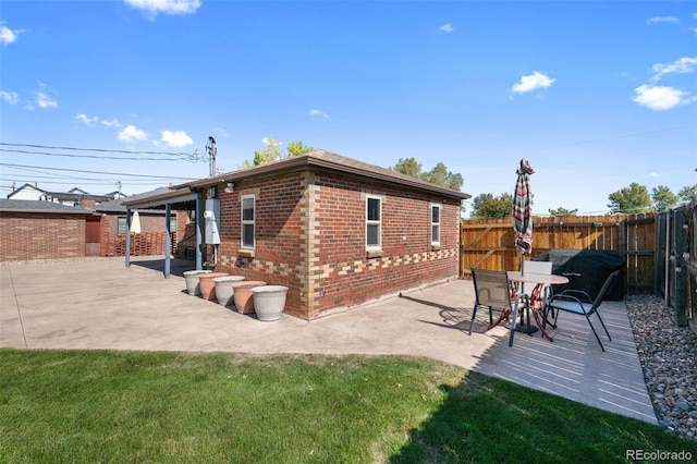 exterior space with a yard and a patio