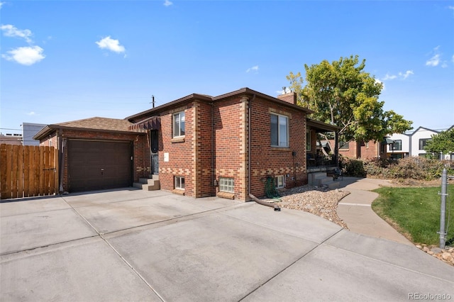 view of side of property with a garage