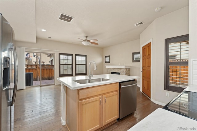 10044 Martin Luther King Blvd, Denver, CO 80238 - kitchen with stainless steel appliances, a sink, ceiling fan, dark wood-style floors, and healthy amount of natural light