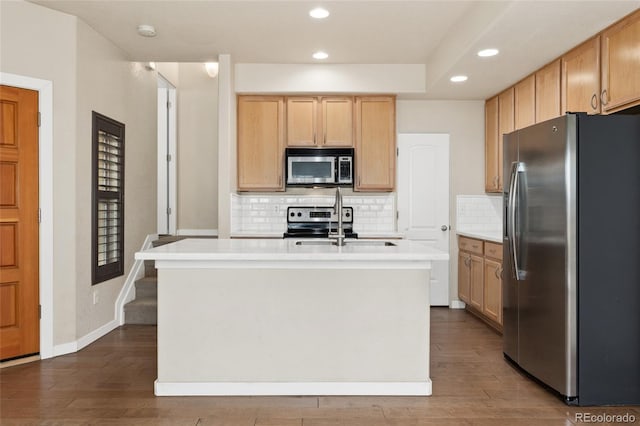 10044 Martin Luther King Blvd, Denver, CO 80238 - kitchen featuring stainless steel appliances, recessed lighting, backsplash, light countertops, and dark wood-style floors