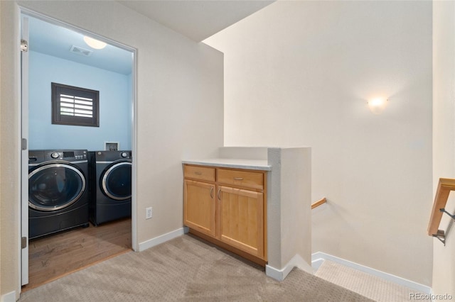 10044 Martin Luther King Blvd, Denver, CO 80238 - washroom with washing machine and dryer, baseboards, and light carpet
