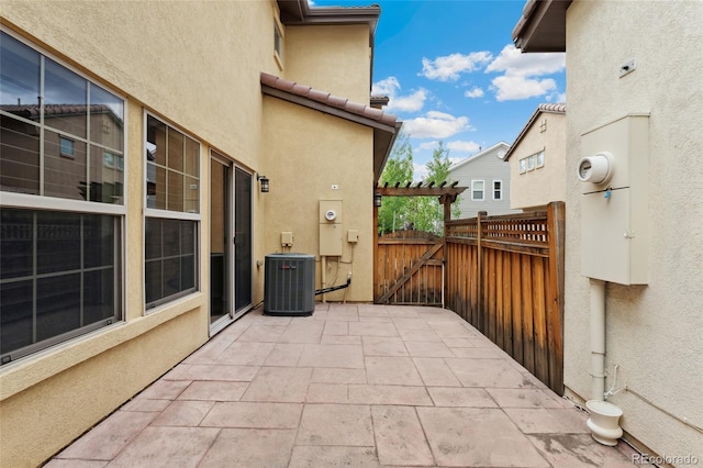 10044 Martin Luther King Blvd, Denver, CO 80238 - view of patio / terrace with central air condition unit and a gate