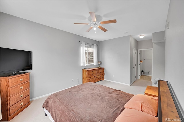 bedroom with light carpet, a ceiling fan, and baseboards