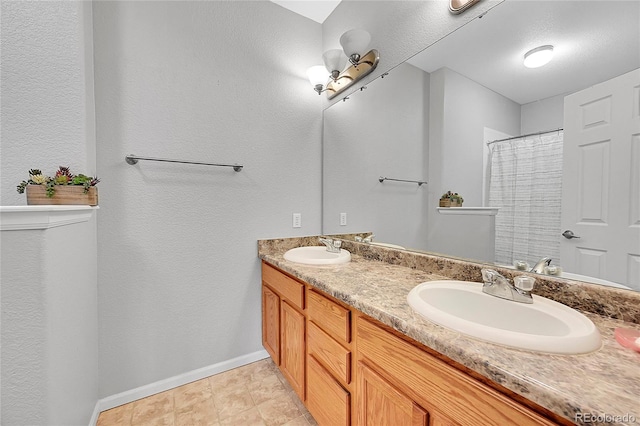 bathroom with double vanity, a sink, and a shower with curtain