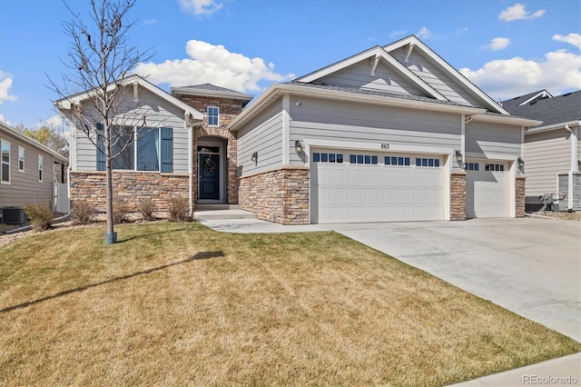 863 Shirttail Peak Dr, Windsor, CO 80550 - craftsman house featuring stone siding, a garage, concrete driveway, a front yard, and cooling unit