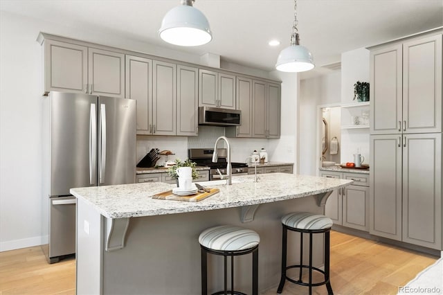 863 Shirttail Peak Dr, Windsor, CO 80550 - kitchen featuring appliances with stainless steel finishes, gray cabinets, open shelves, a sink, and recessed lighting