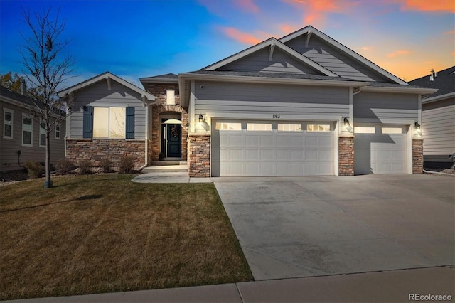 863 Shirttail Peak Dr, Windsor, CO 80550 - craftsman inspired home with stone siding, an attached garage, a front yard, and concrete driveway