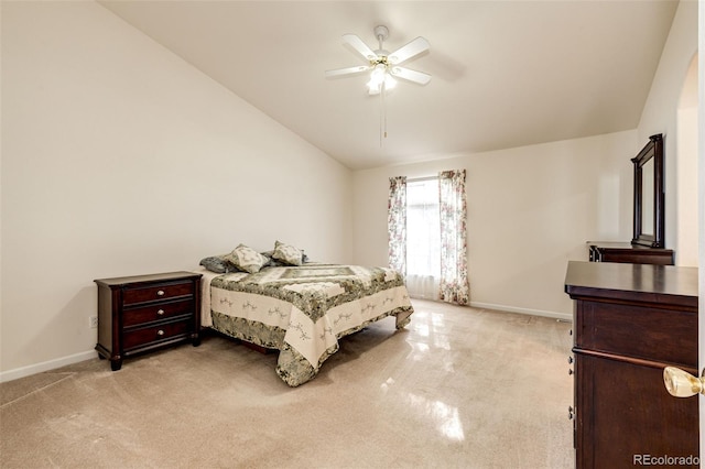 carpeted bedroom featuring ceiling fan and vaulted ceiling