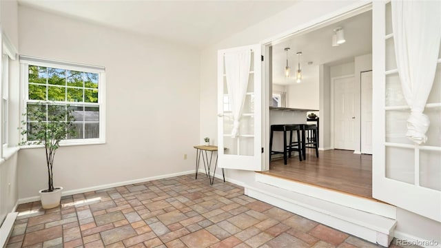 2918 Silverplume Dr Unit C1, Fort Collins, CO 80526 - unfurnished room with baseboards and stone finish flooring