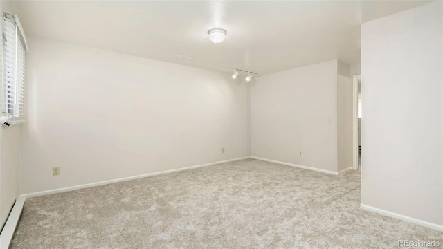 2918 Silverplume Dr Unit C1, Fort Collins, CO 80526 - carpeted spare room featuring rail lighting and baseboards