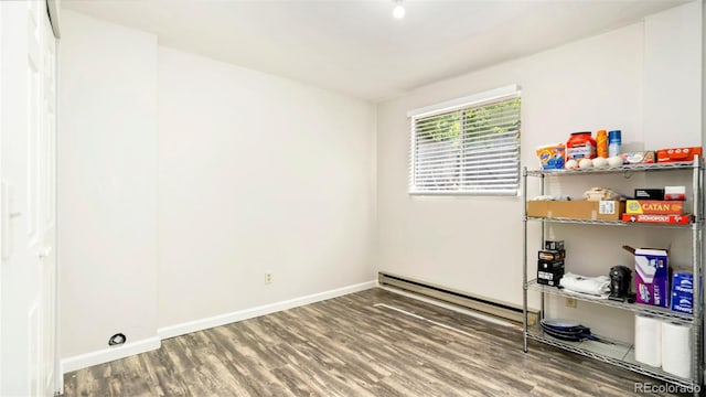 2918 Silverplume Dr Unit C1, Fort Collins, CO 80526 - empty room with wood finished floors and a baseboard radiator