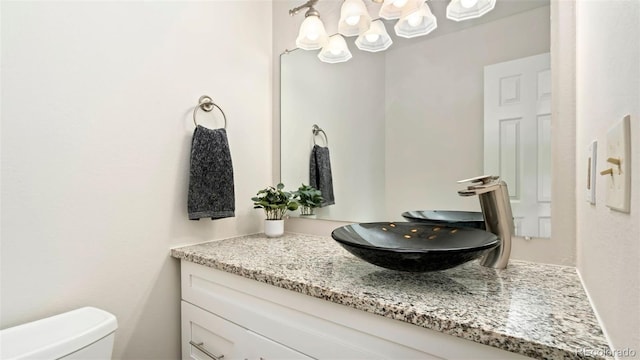 2918 Silverplume Dr Unit C1, Fort Collins, CO 80526 - half bathroom featuring a chandelier and vanity