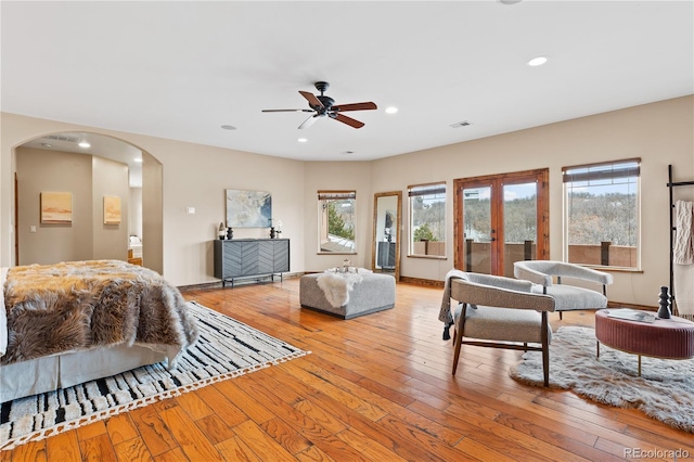 bedroom featuring french doors and light wood-type flooring