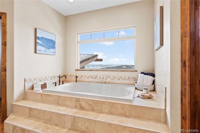 bathroom with tiled bath