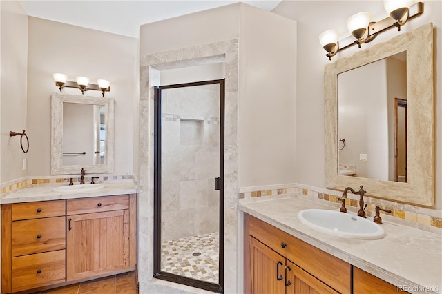 bathroom with vanity and an enclosed shower