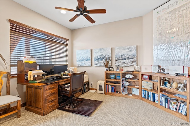 office area with ceiling fan and light carpet