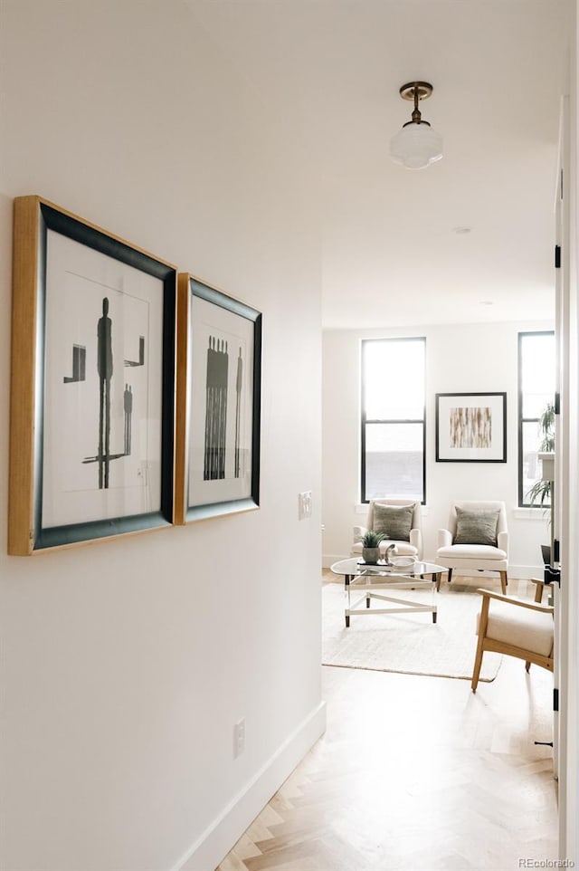 2753 Curtis St, Denver, CO 80205 - hallway featuring baseboards