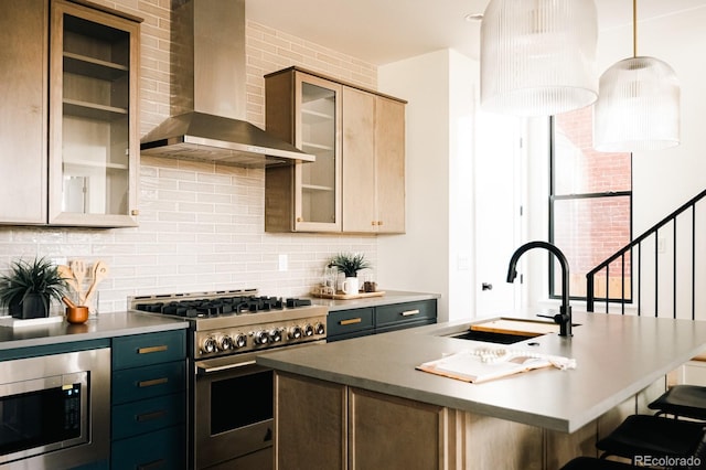 2753 Curtis St, Denver, CO 80205 - kitchen with a sink, backsplash, stainless steel appliances, wall chimney exhaust hood, and a kitchen island with sink