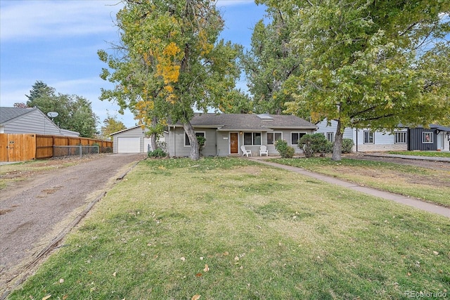 view of front facade with a front yard and a garage