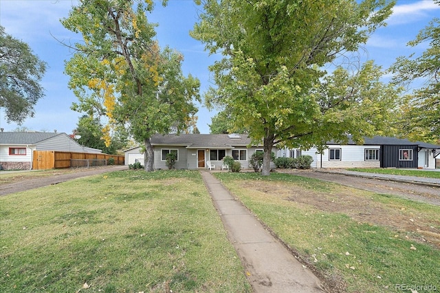 single story home with a garage and a front yard