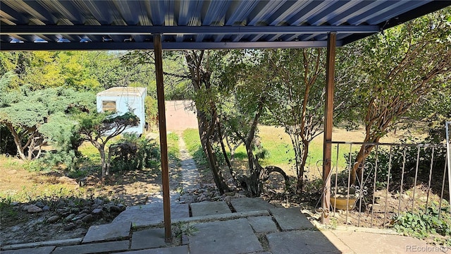 view of patio / terrace with a shed