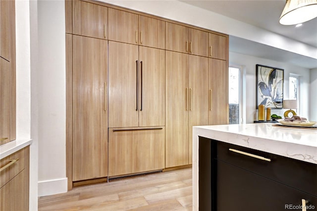 kitchen featuring light hardwood / wood-style floors and light brown cabinetry