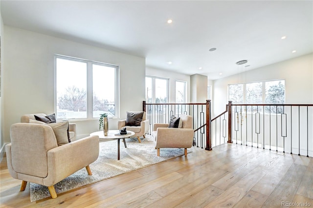 living area with light hardwood / wood-style floors