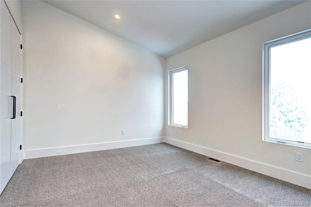 spare room featuring carpet floors