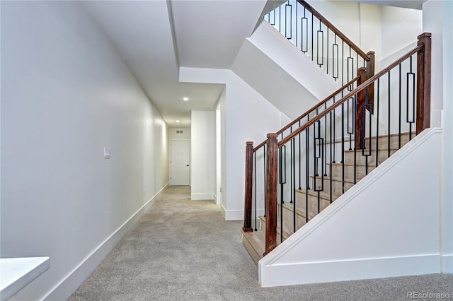 staircase with carpet