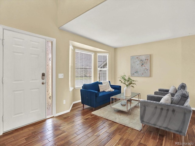 entrance foyer featuring wood finished floors and baseboards